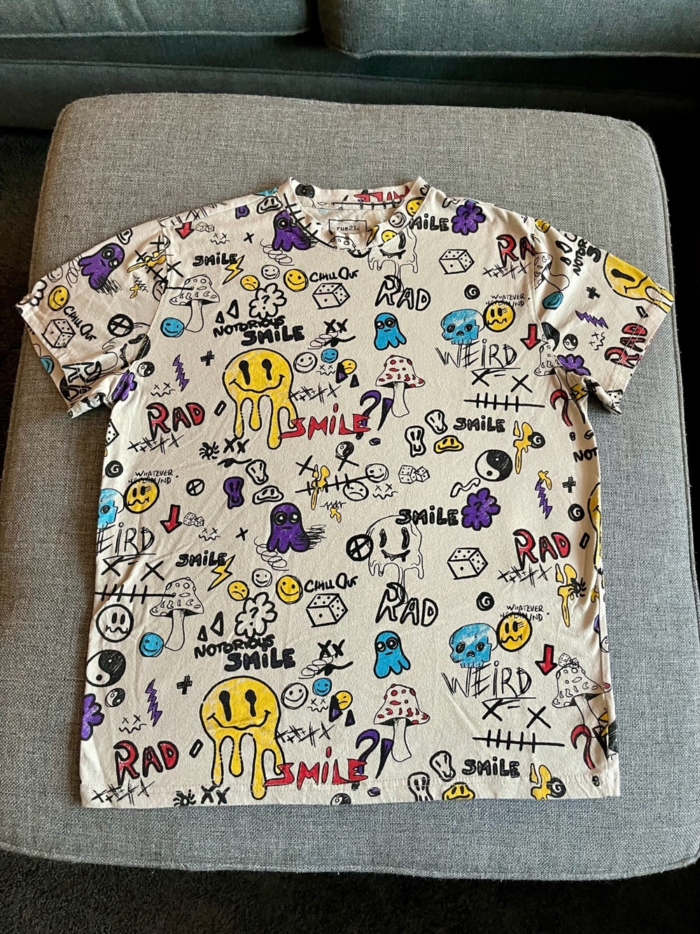Rue21 Cream Graphic Tee with Black, Yellow, Purple and Blue Prints